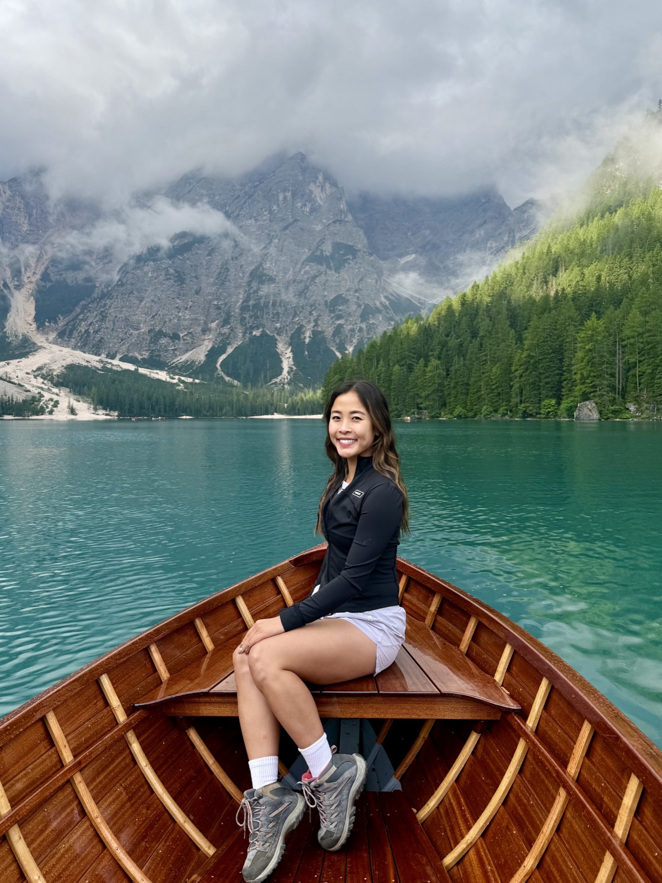 Tylee in a rowboat on a lake in the Dolomites